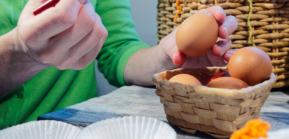 Preparing to decorate a basket of eggs