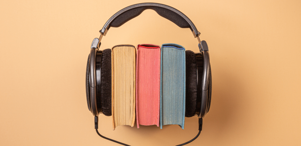 Three books held together by headphones.
