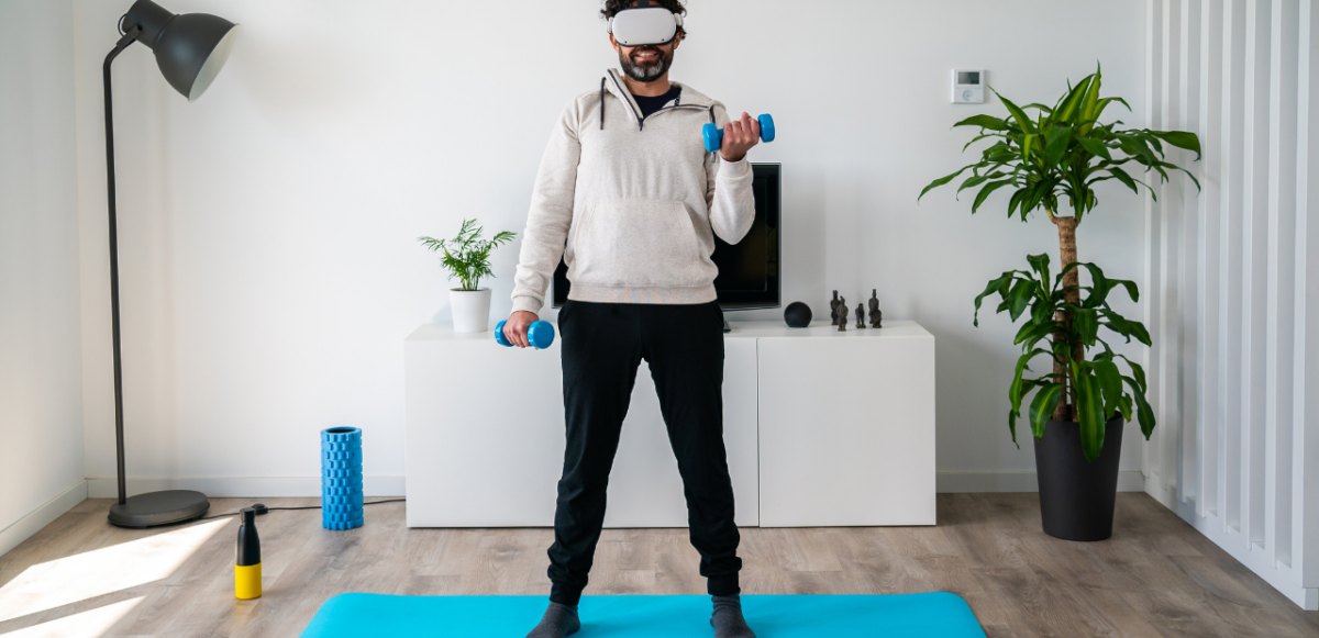 man lifting weights while wearing a VR headset