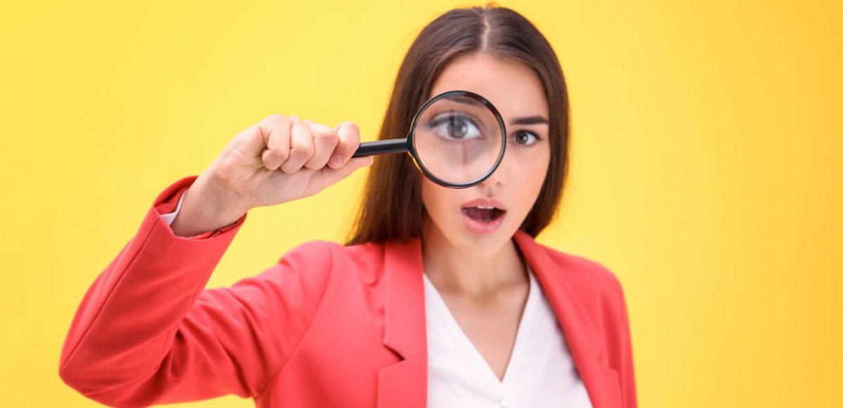 Woman with magnifying glass