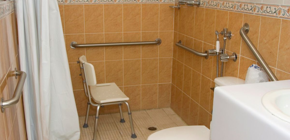 A shower seat in an accessible shower