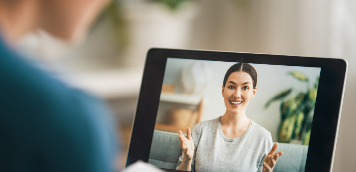 Two people engaged in a video call on a tablet