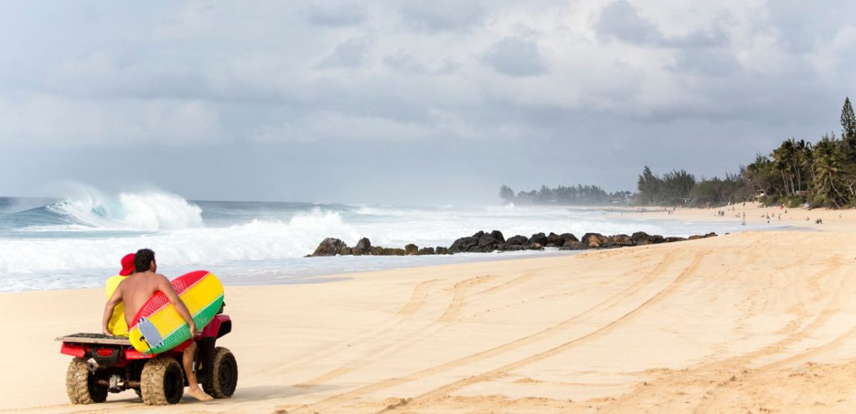 Surfers on Banzai Pipeline